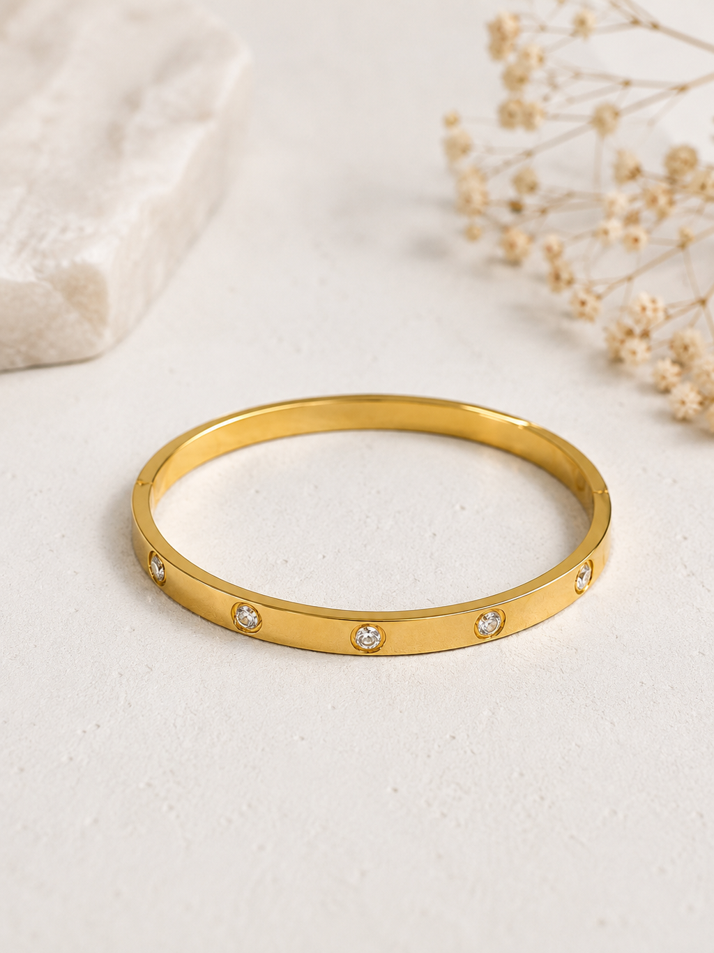 Lifestyle shot of gold CZ bangle