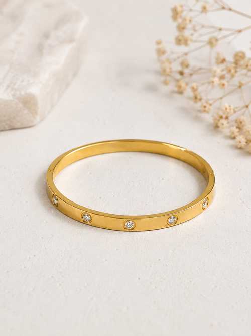 Lifestyle shot of gold CZ bangle