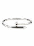 Silver-tone nail bracelet combo set on a white background