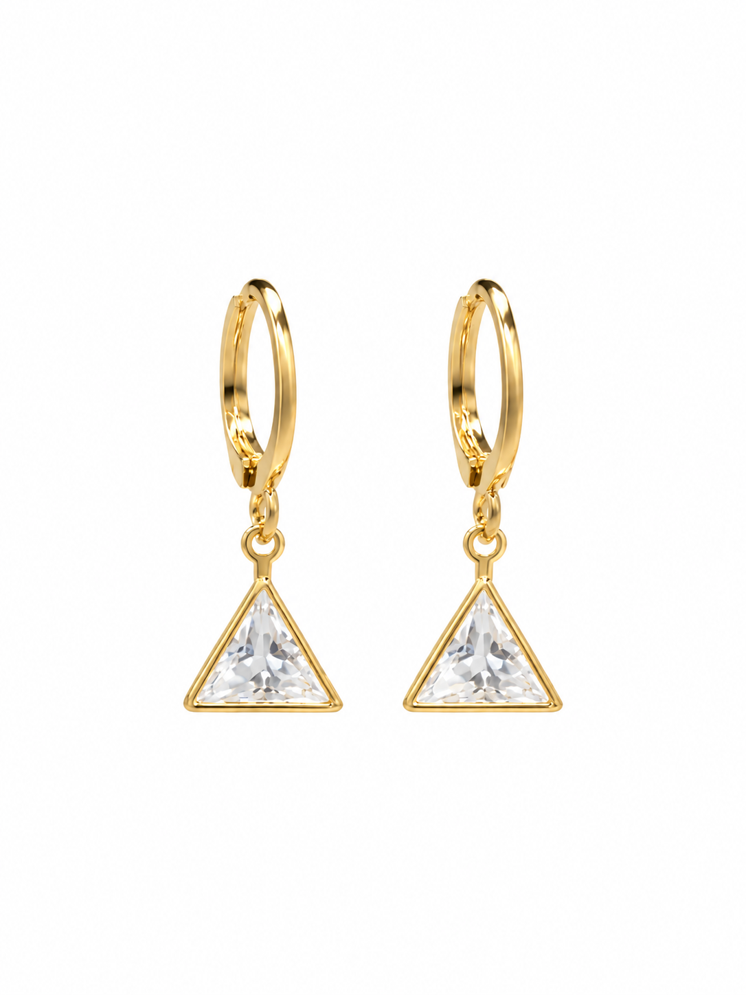 Close-up of gold huggie hoops with triangular crystal drops