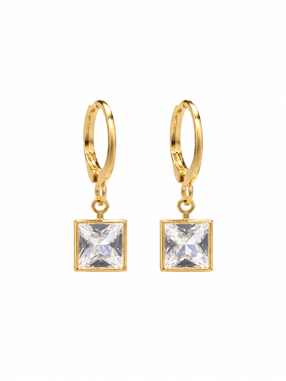 Close-up of gold-tone hoop earrings with square clear crystal pendants
