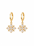 Gold snowflake cross CZ drop earrings close up