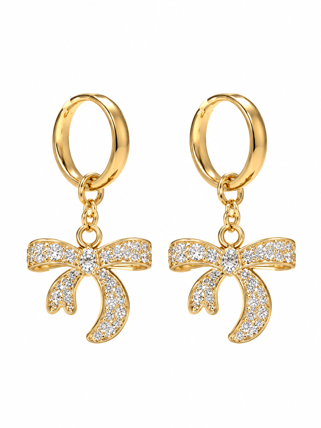 Pair of gold-tone hoop earrings with sparkling bow charms on white background