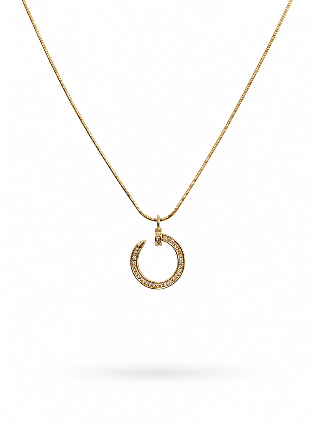 Crystal circle pendant necklace on gold snake chain